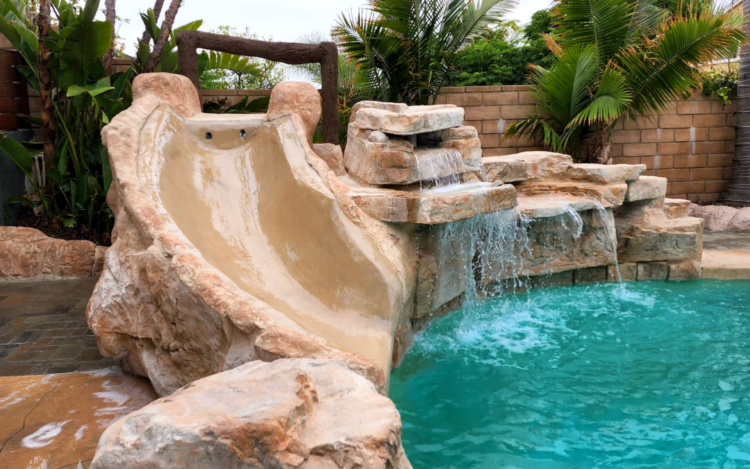Need a splash of fun? Add a waterfall with a slide enclosure!